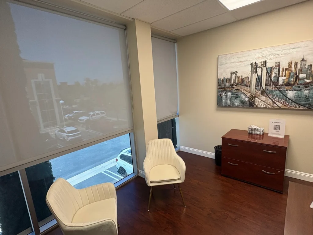 Pacific Digital office interior with lounge chairs and a city skyline painting